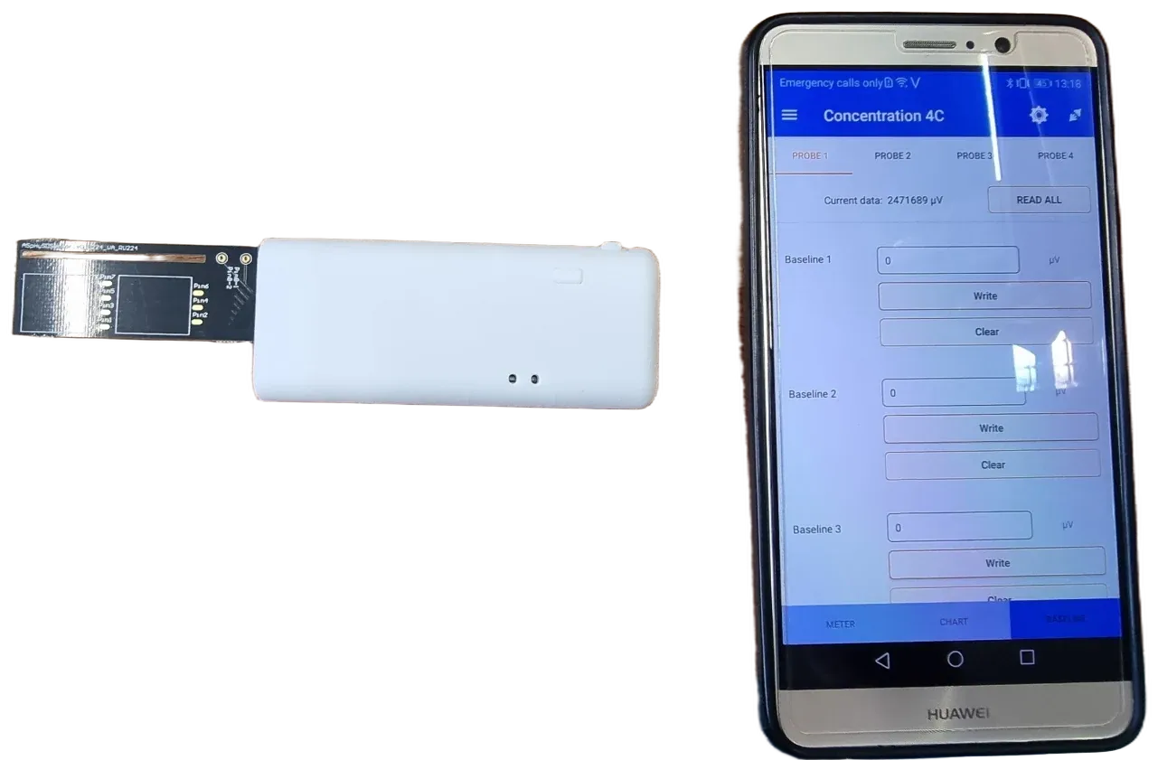 The smart probe beside a phone running its reader app